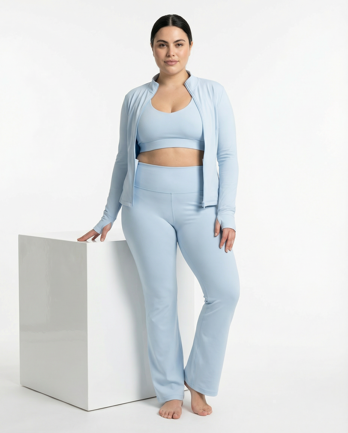 Women's 3-piece flare pants, sports bra, and jacket set by seen, shown in a stylish activewear outfit.