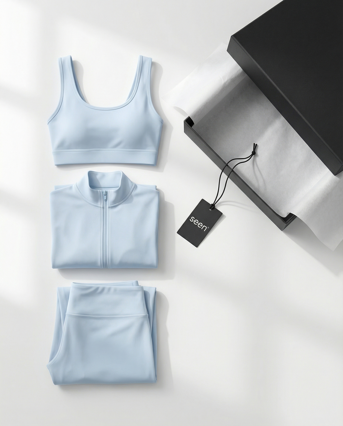 Seen women's 3-piece flare pants, sports bra, and jacket set, shown on a model in a stylish activewear outfit.