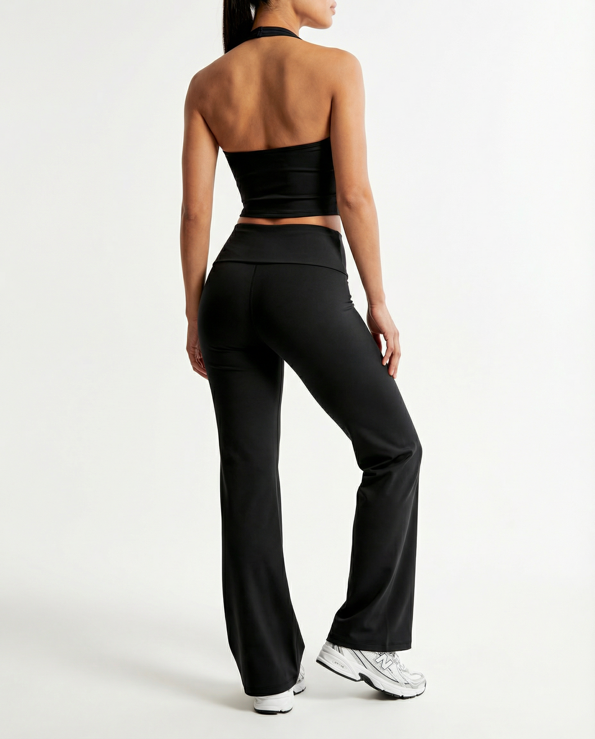 Seen flare yoga pants set with high waist and halter sports bra, featuring comfortable stretch fabric and stylish flare design.