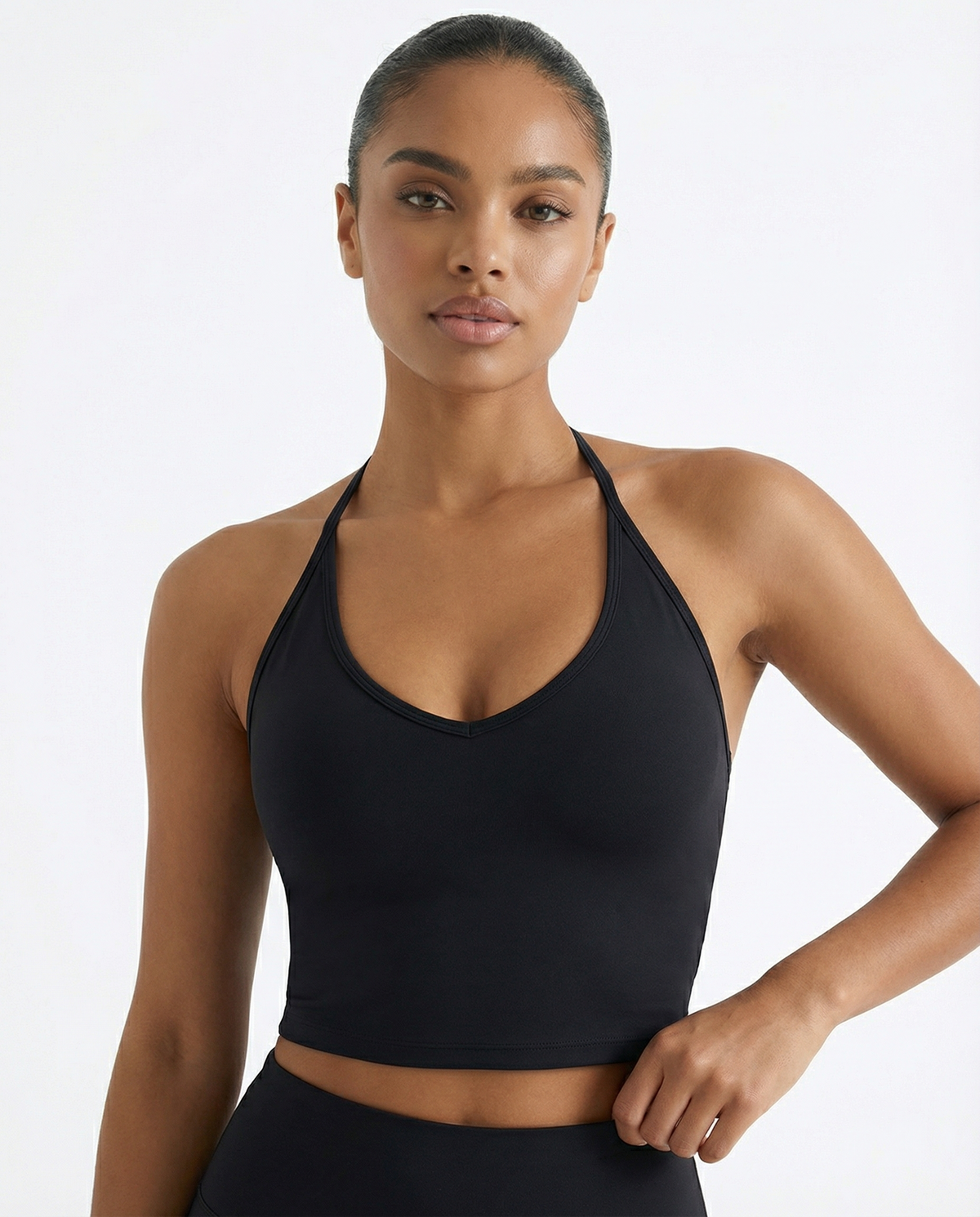 Women's seen sports top with halter neck, seamless sculpting fit, part of activewear set, designed for comfort and support.