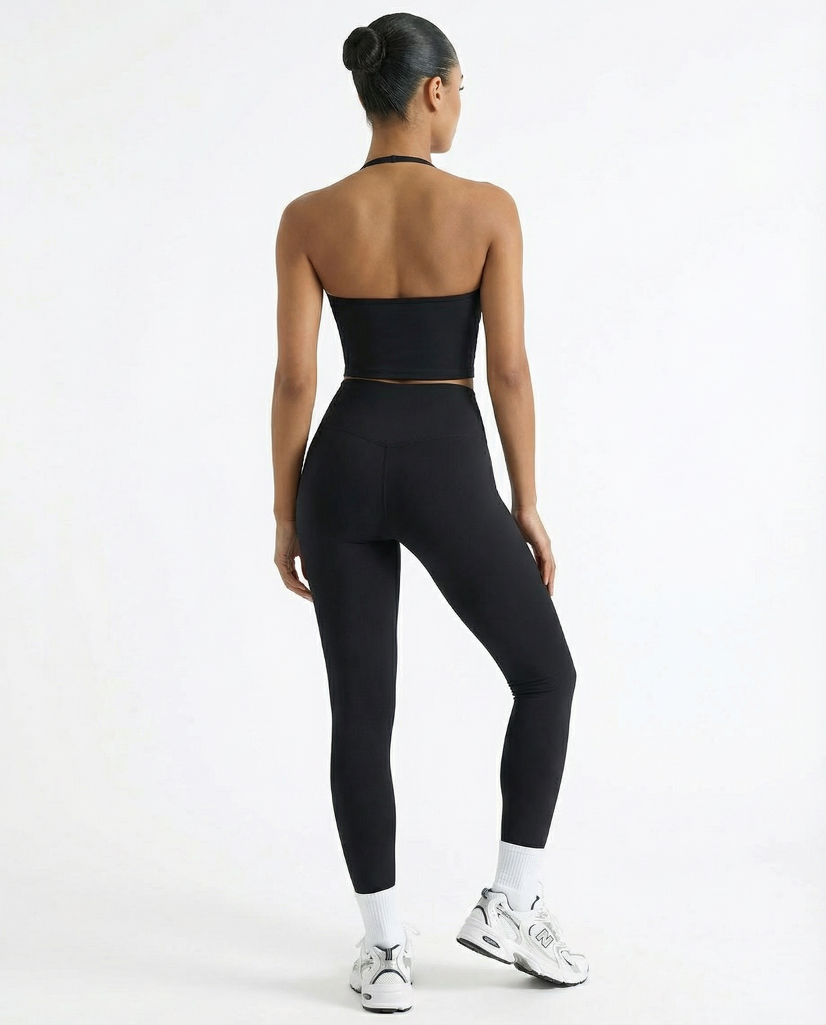 Seen high waist leggings set with sculpting fit and matching halter top, designed for women's activewear and workout comfort.