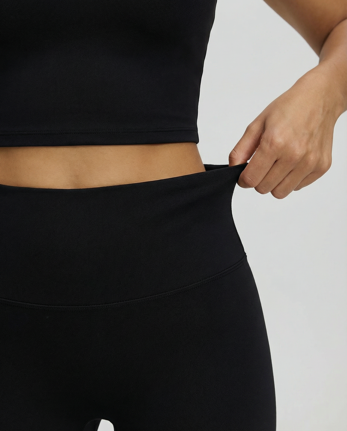 Seen women's high waist leggings set with sculpting fit and halter top, displayed on a model in activewear style.