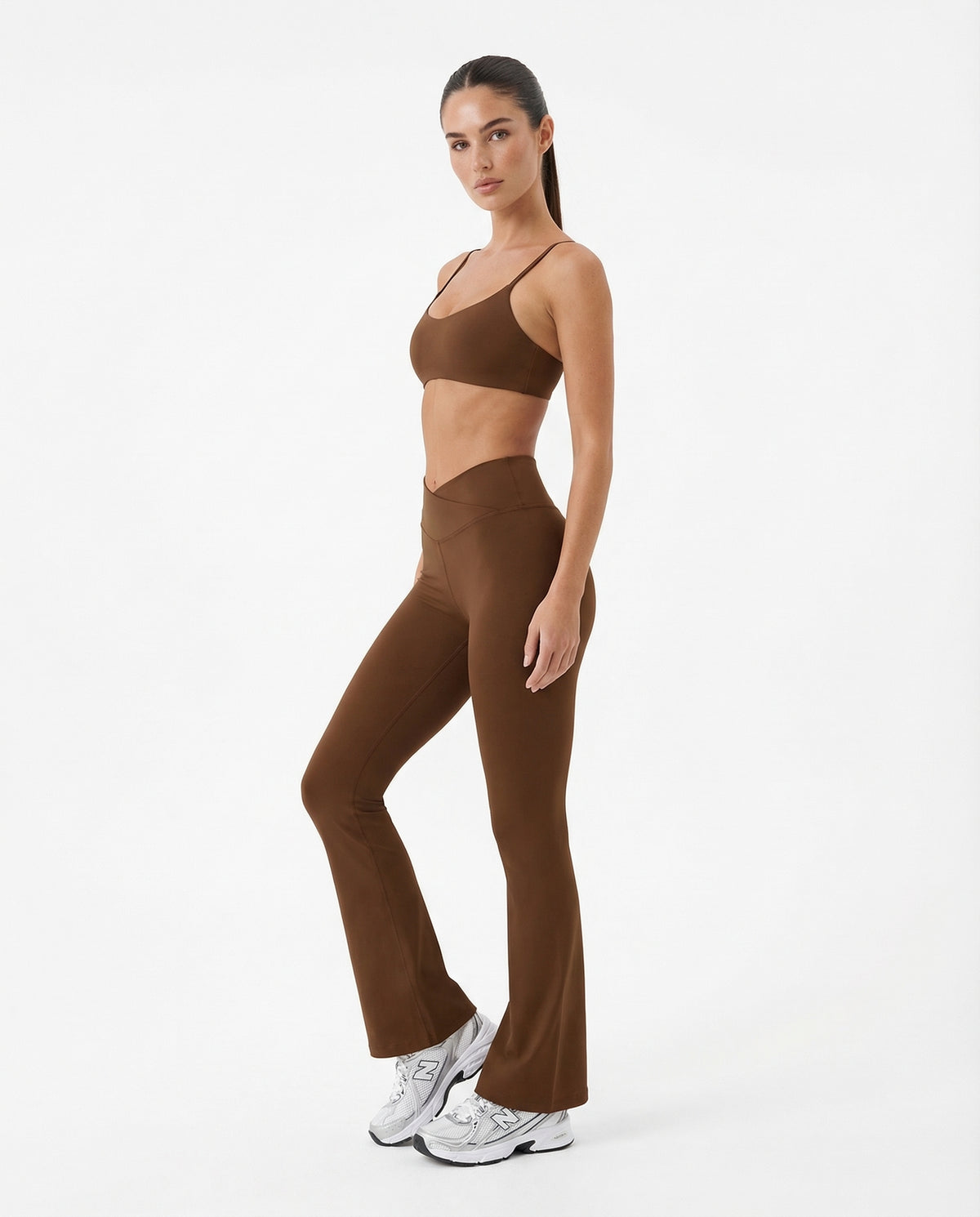 Seen women's flare yoga pants set with high waist leggings and matching sports bra, shown in a comfortable activewear outfit.