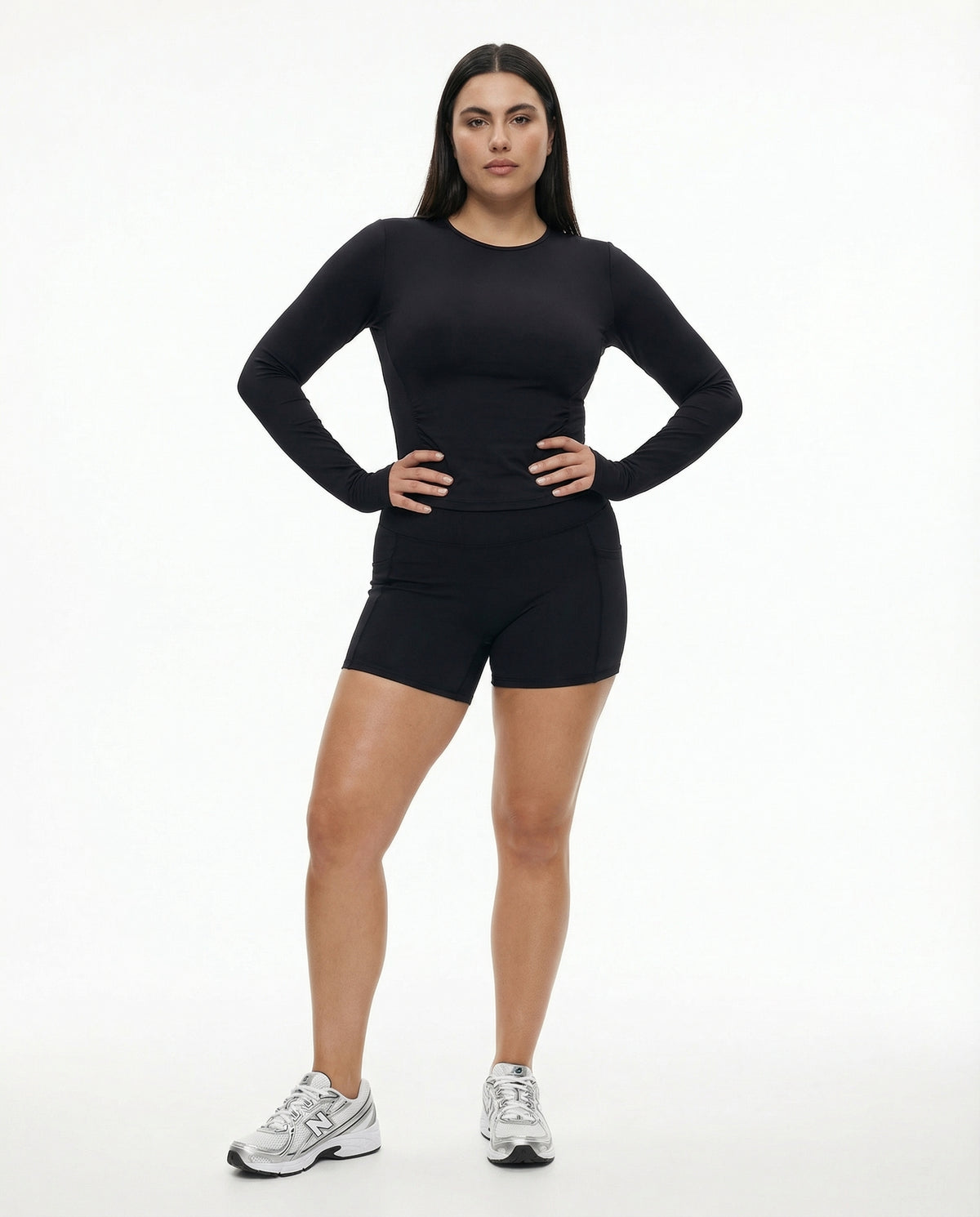 Seen women's workout set with long sleeve top and biker shorts, featuring a sleek, fitted design for active wear.