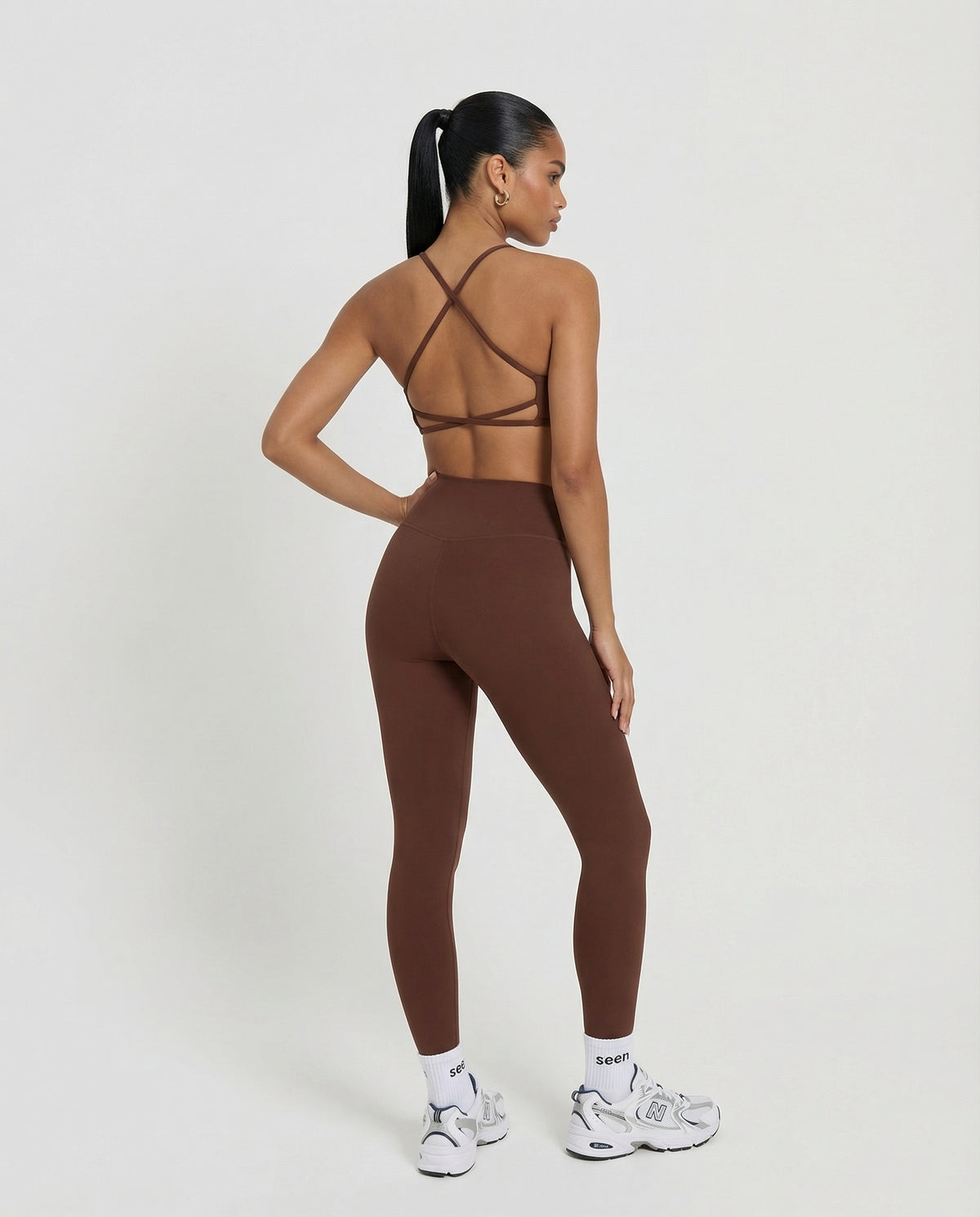 Seen women's seamless workout set with sculpting high waist leggings and matching sports top, designed for activewear and fitness.
