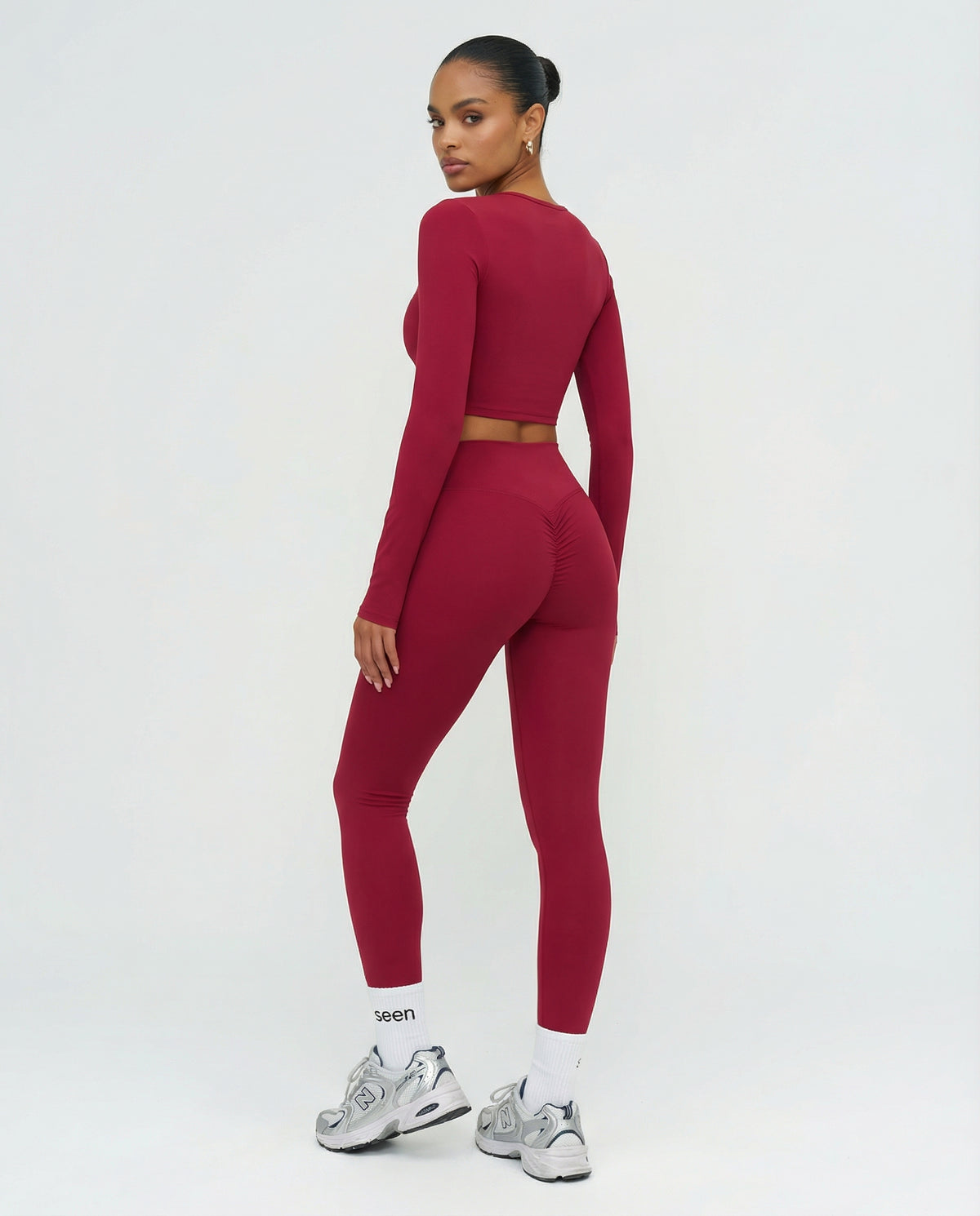 Seen women's activewear set with long sleeve top and high waist leggings, designed for comfortable workout wear.