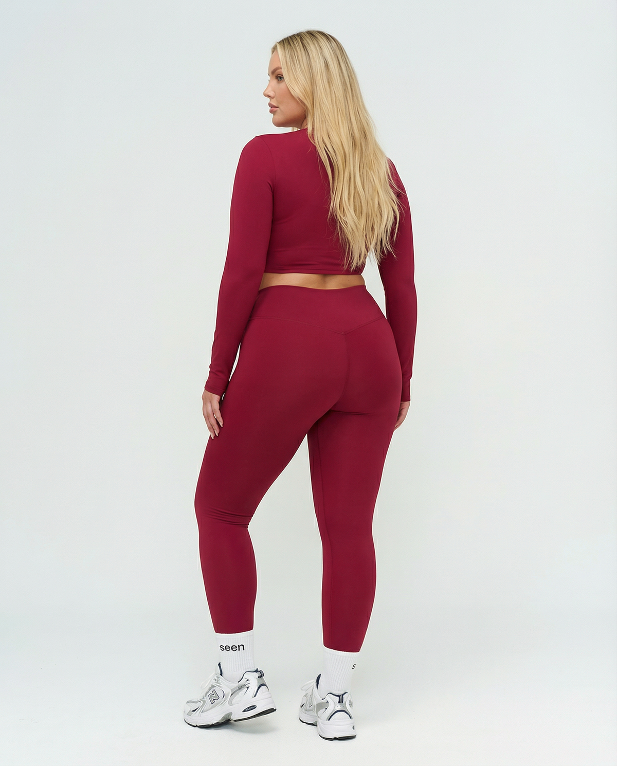 Seen women's activewear set featuring long sleeve top and high waist leggings, perfect for workout and athletic activities.