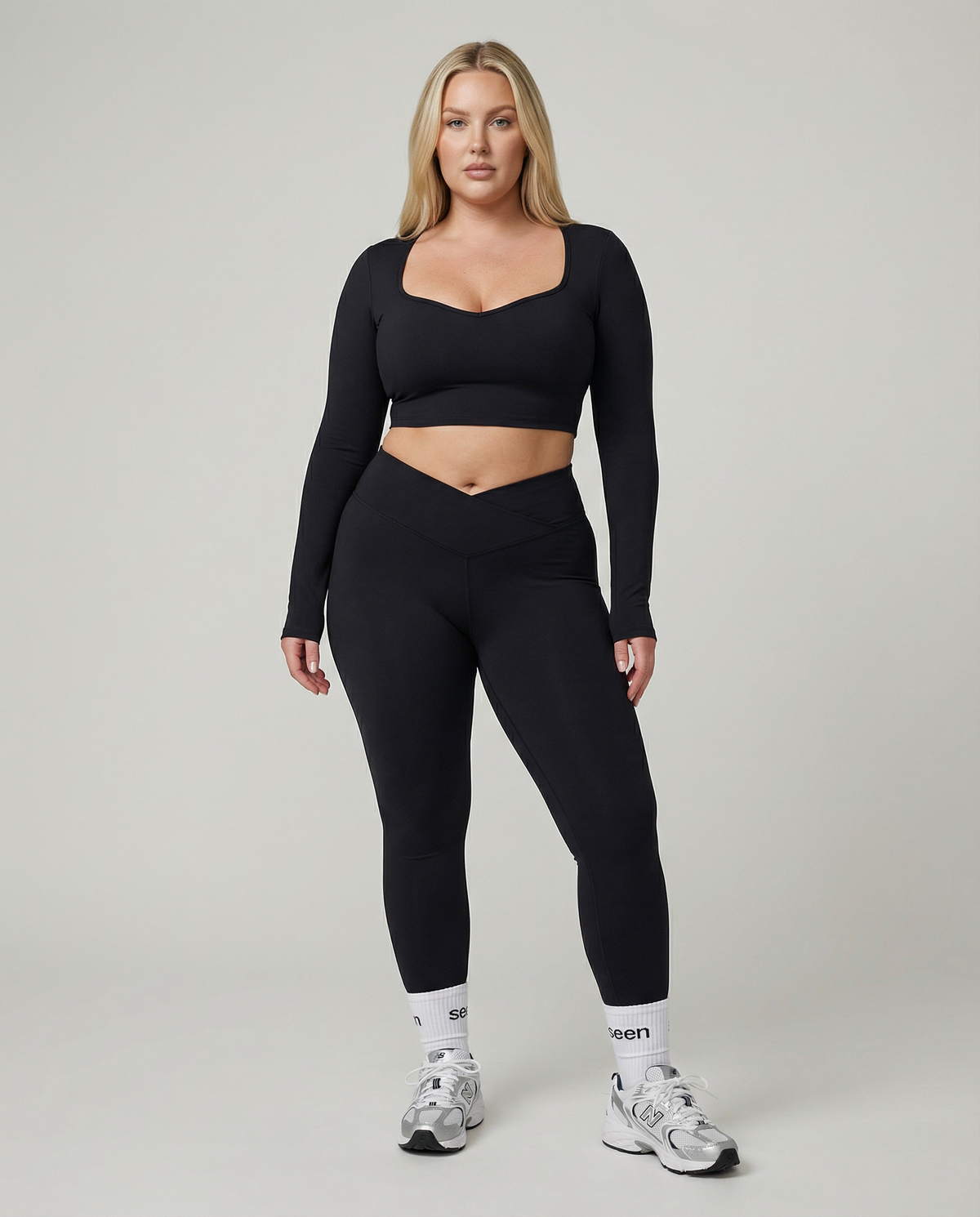 Seen women's activewear set featuring long sleeve top and high waist leggings in a coordinated athletic outfit.