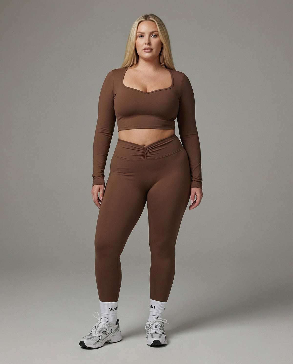 Seen women's activewear set featuring long sleeve top and high-waist leggings, ideal for workout and active lifestyle.