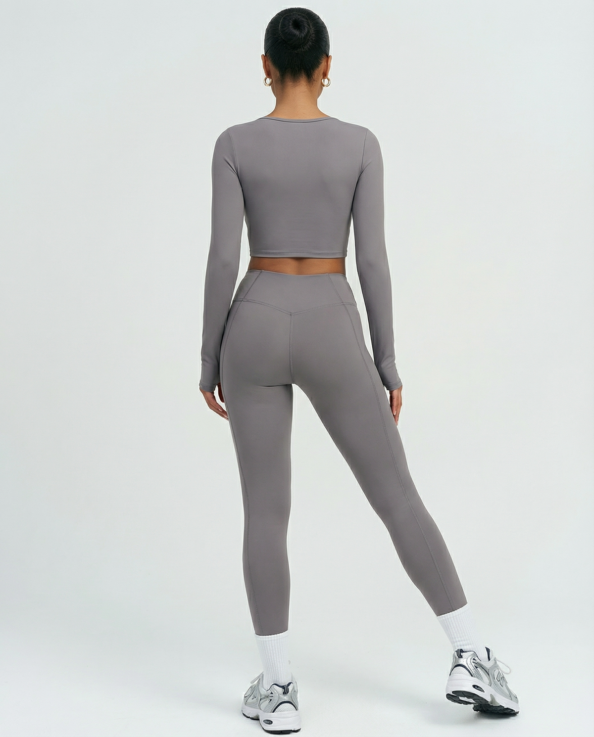 Seen women's activewear set with long sleeve top and high waist leggings, stylish and comfortable workout clothing.