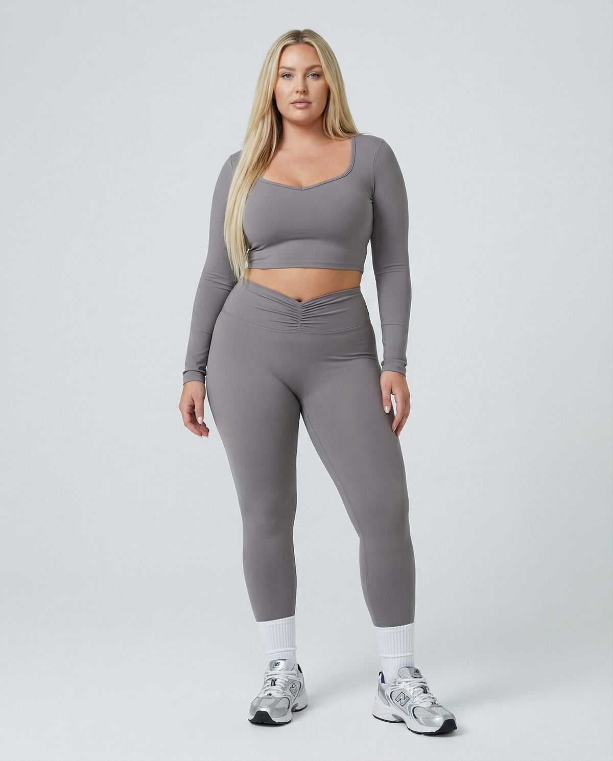 Seen women's activewear set with long sleeve top and high waist leggings, shown in a comfortable and stylish fit.