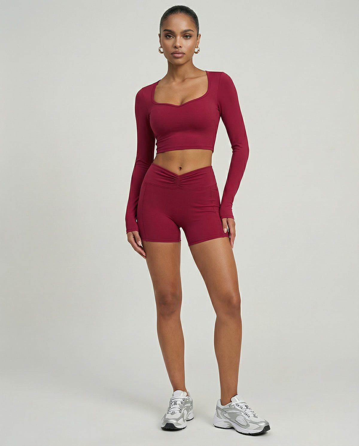 Seen women's activewear set with sculpting biker shorts and long-sleeve top, designed for workout and athleisure wear.