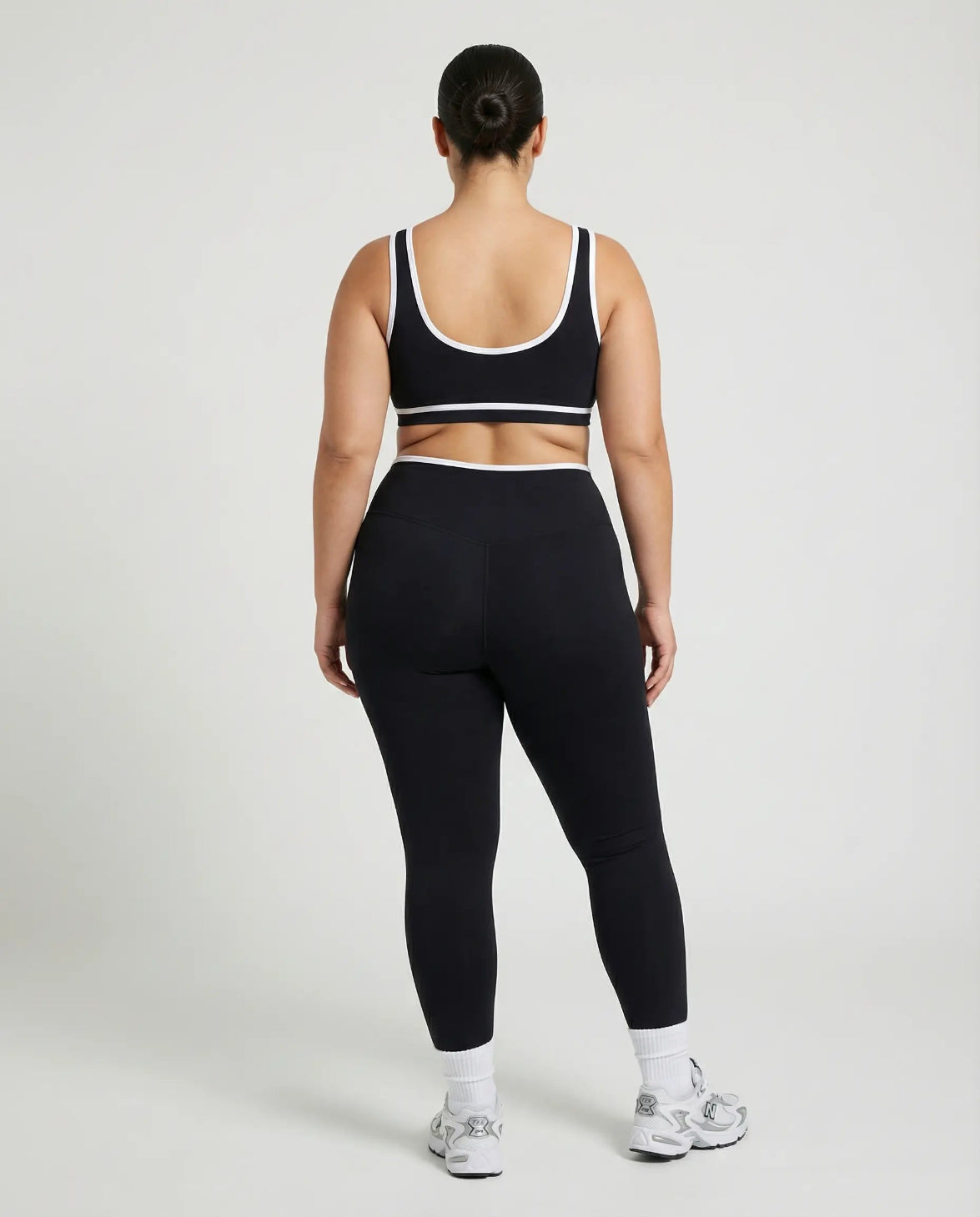 Woman wearing seamless sculpt activewear set with high waist leggings and supportive sports bra designed for gym, yoga, and athleisure wear.