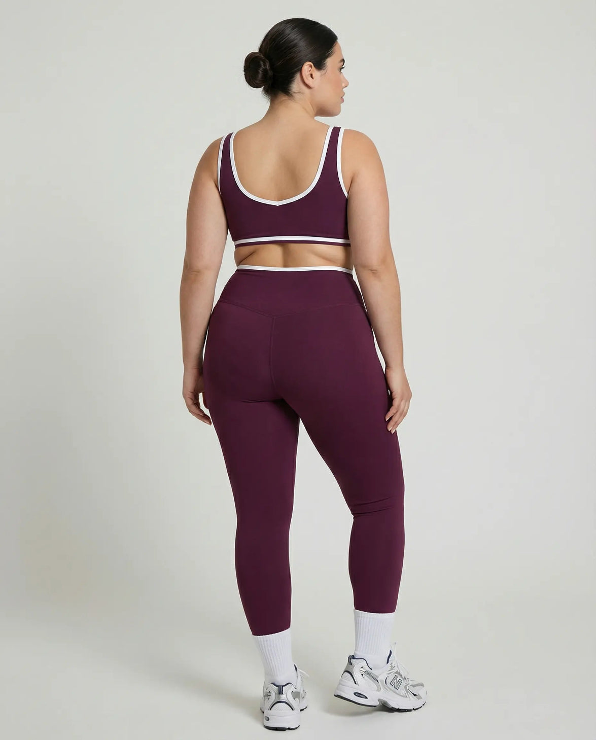 Woman wearing seamless sculpt activewear set with high waist leggings and supportive sports bra designed for gym, yoga, and athleisure wear.