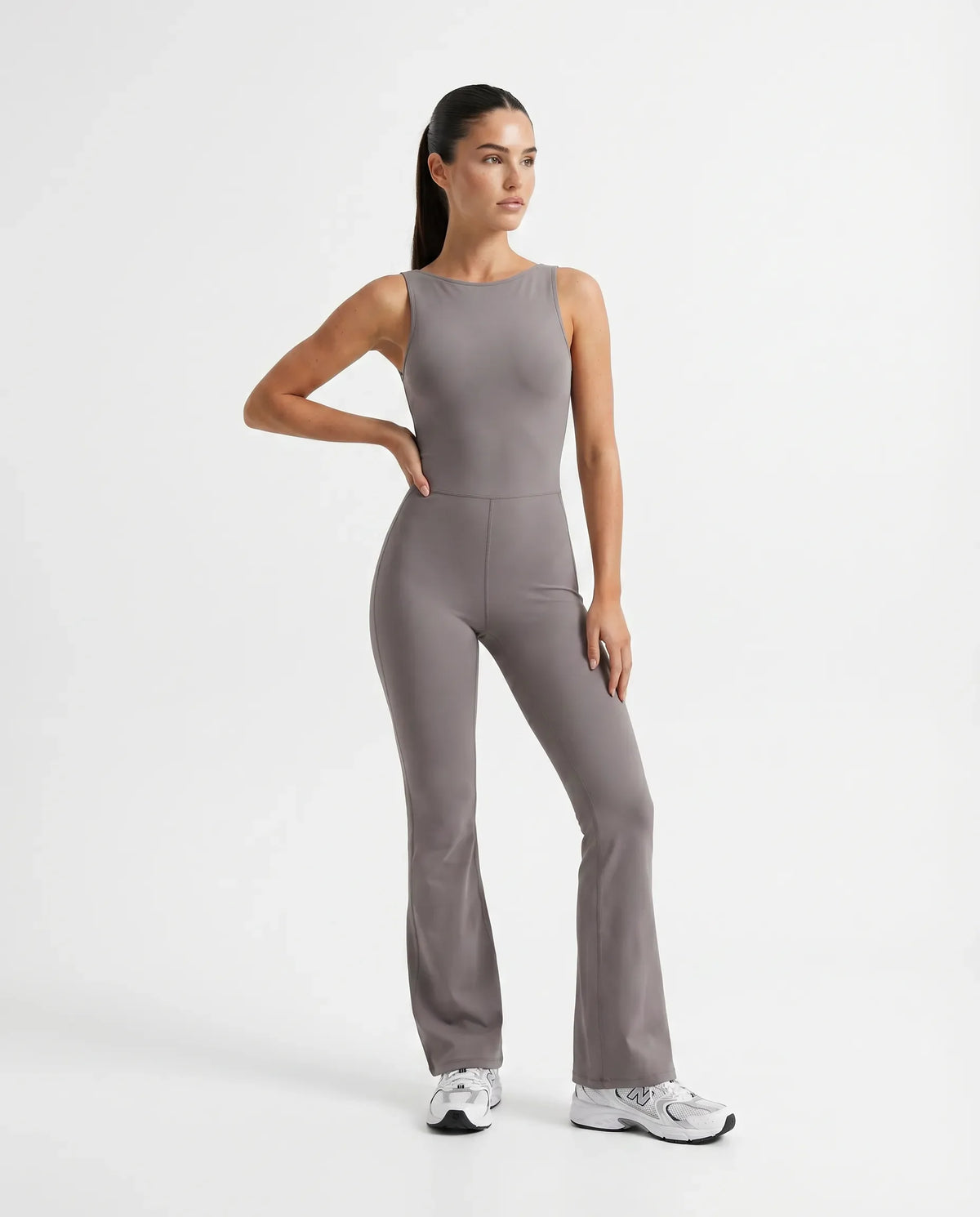 Ghost mannequin front view of purple backless flare bodysuit showing high waist seam and sculpting fit.