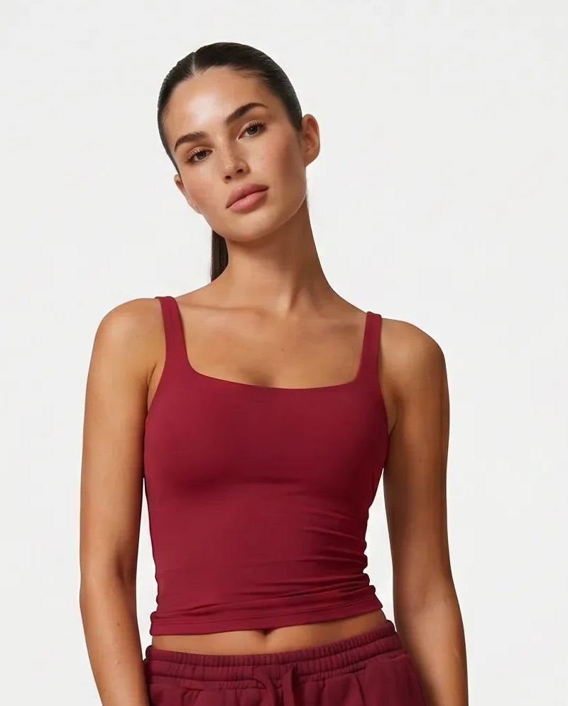 Ghost mannequin front view of red sculpting sleeveless tank top with square neckline and wide straps.