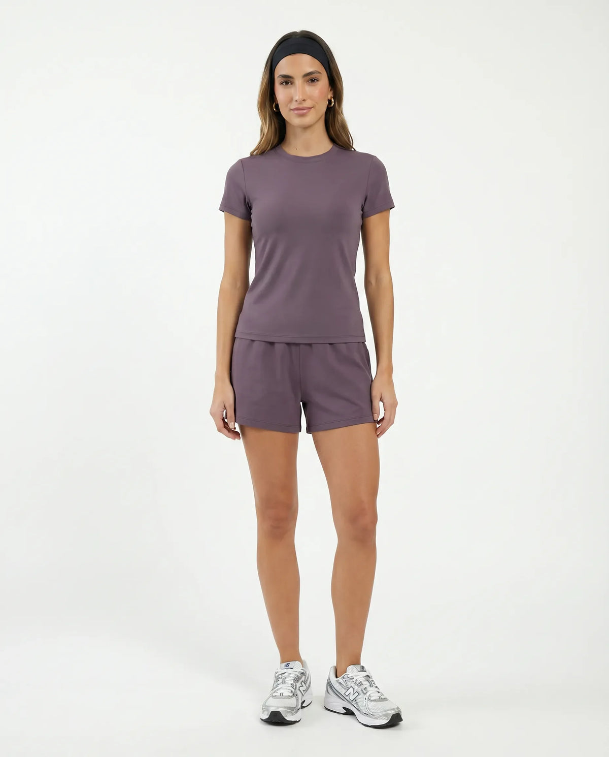Ghost mannequin back view of purple fitted t-shirt top displaying clean back seam detail.