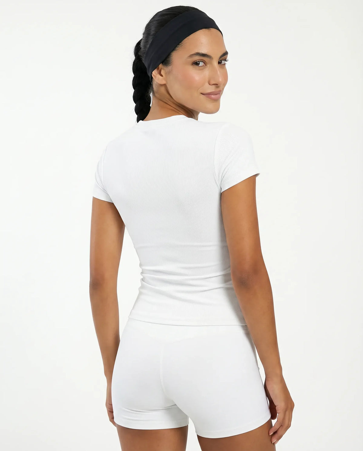 Ghost mannequin back view of white ribbed t-shirt top displaying clean seam finish and fitted silhouette.