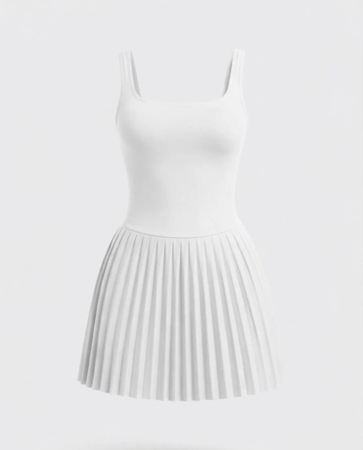 Woman wearing the SEEN Essential white tennis dress in a lifestyle setting, styled for an active day out.