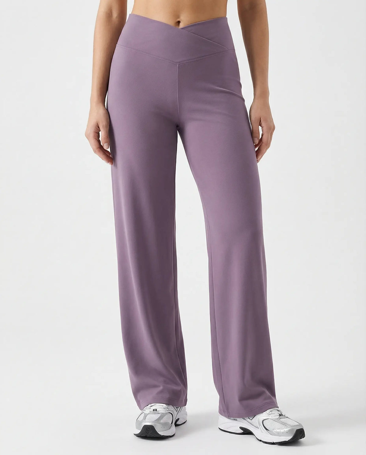 Close-up of mauve high waist crossover wide leg leggings showing the sculpting V-panel crossover waistband, front view.