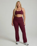 Seen women's activewear set with red flare leggings and matching sculpt fit sports bra, designed for yoga and workouts.