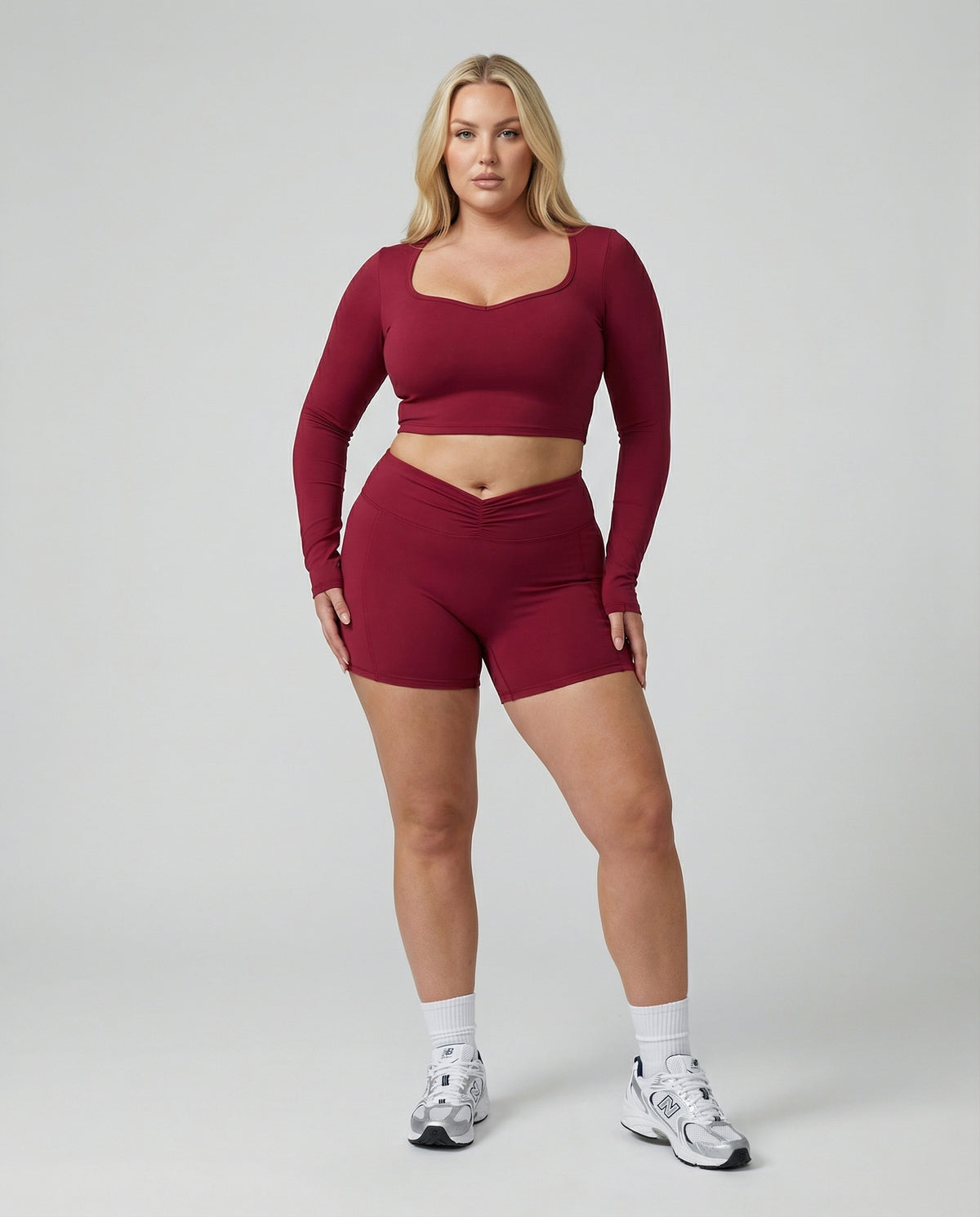 Seen women's activewear set with sculpting biker shorts and long sleeve top, ideal for workout and athletic activities.