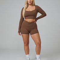 Seen women's activewear set with sculpting brown biker shorts and long sleeve top, perfect for workout and casual wear.