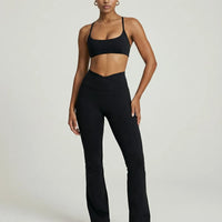 Seen women's activewear set with black yoga flare leggings and matching sculpt fit sports bra, front view.