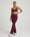 Red vine women's activewear set featuring sculpt fit yoga flare leggings and matching sports bra for comfortable workout attire.