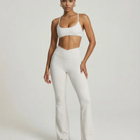 Seen women's activewear set with white yoga flare leggings and matching sculpt fit sports bra, ideal for workout and yoga sessions.