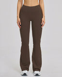 Front view of brown high waist flare leggings with sculpting compression fit and smooth waistband, styled with white sneakers.