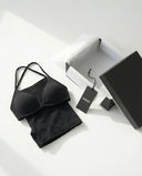 Model wearing a black seamless sculpt gym set with high waist shorts and a supportive sports bra paired with athletic sneakers.
