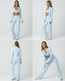 Seen women's 3-piece set with flare pants, sports bra, and jacket, laid out on a flat surface.