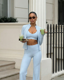 Seen women's 3-piece set with flare pants, sports bra, and jacket, featuring stylish, coordinated activewear for workout and casual wear.