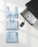 Seen women's 3-piece flare pants, sports bra, and jacket set, shown on a model in a stylish activewear outfit.