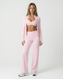 Women's Seen 3-piece set with flare pants, sports bra, and jacket, shown laid out on a surface with neutral background.