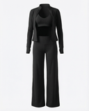 Seen women's 3-piece set with flare pants, sports bra, and jacket, displayed on a hanger against a white background.