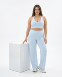 Seen flare yoga pants set with high waist and halter sports bra, featuring a stylish and comfortable activewear design.