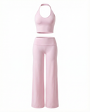 Seen flare yoga pants set with high waist and halter sports bra, featuring a stylish and comfortable activewear design.