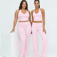 Seamless women's sports top with halter neck, sculpting fit, in black, designed for active wear by seen.