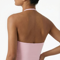Seen women's sports top with halter neck, seamless design, and sculpting fit, shown in a close-up front view.
