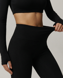Seen flare yoga pants set featuring high waist, long sleeve crop top, and flare leggings, perfect for active and casual wear.