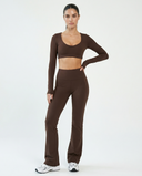 Seen flare yoga pants set with high waist and long sleeve crop top, featuring a fitted silhouette and comfortable stretch fabric.