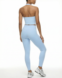Seen high waist leggings set with sculpting fit and matching halter top, shown on a mannequin. Black athletic activewear ensemble.