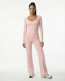 Seen flare yoga pants set with high waist wide-leg yoga pants and matching crop top, shown in soft, stretchy fabric.