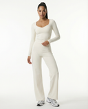 Seen women's flare yoga pants set with high waist wide-leg pants and matching crop top, displayed on a neutral background.