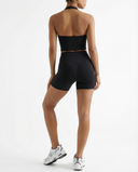 Seen women's activewear set with a halter top and high-waist shorts, shown in a stylish, comfortable fitness outfit.