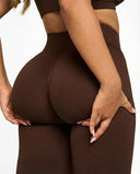 Seen Snatched V-Waist Flare Leggings shown in black, featuring high-rise fit and wide-leg design for a trendy, fitted look.