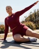Seen women's workout set featuring a long sleeve top and biker shorts, perfect for activewear and fitness activities.