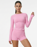 Seen women's workout set featuring a long sleeve top and biker shorts, designed for activewear and fitness activities.